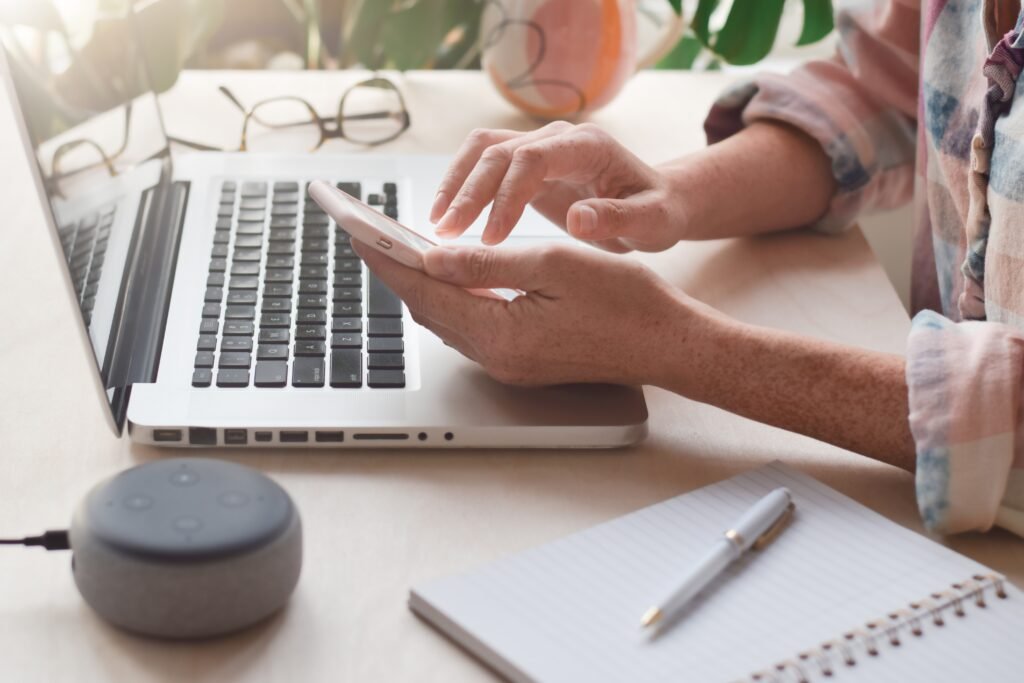digital marketing virtual assistant sitting at desk with laptop